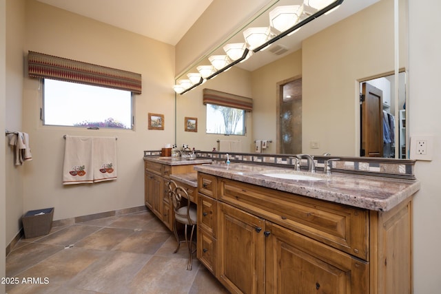 bathroom with vanity and tile patterned flooring