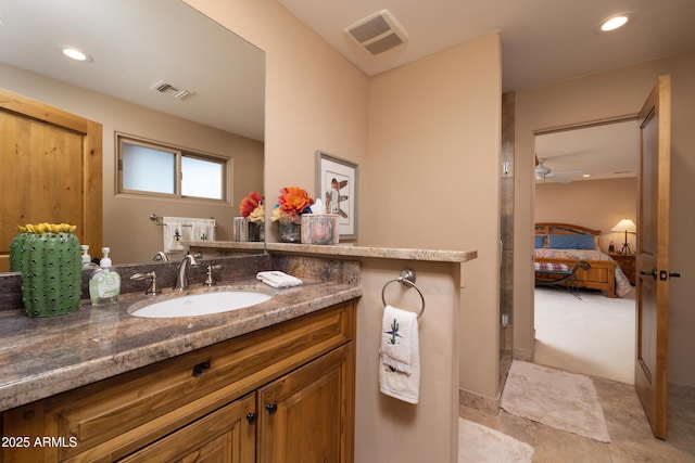 bathroom featuring vanity and ceiling fan