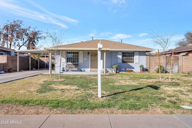 view of front of house featuring a carport, covered porch, and a front lawn