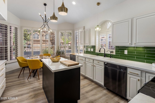 1633 W Acoma Dr, Phoenix, AZ 85023 - kitchen featuring light wood-style floors, dishwashing machine, backsplash, and a sink