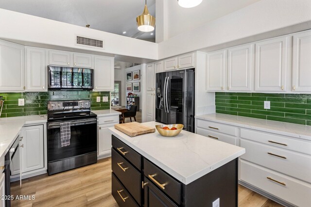1633 W Acoma Dr, Phoenix, AZ 85023 - kitchen with appliances with stainless steel finishes, white cabinetry, visible vents, and dark cabinets