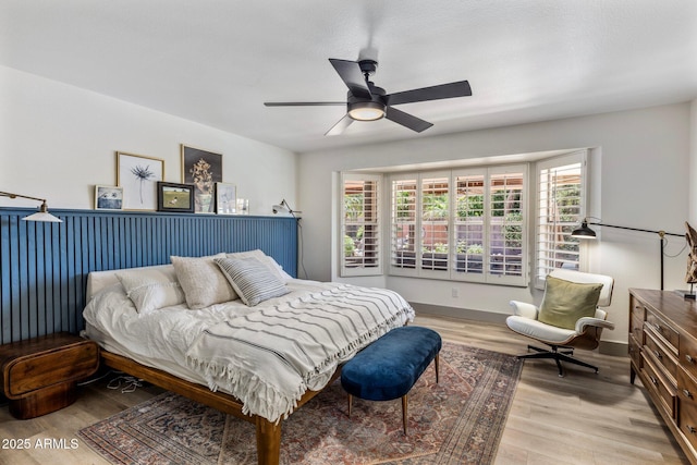 1633 W Acoma Dr, Phoenix, AZ 85023 - bedroom featuring a ceiling fan, light wood finished floors, baseboards, and multiple windows