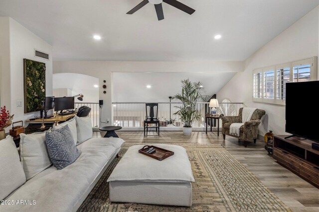 1633 W Acoma Dr, Phoenix, AZ 85023 - living room with a wealth of natural light, wood finished floors, a ceiling fan, and arched walkways