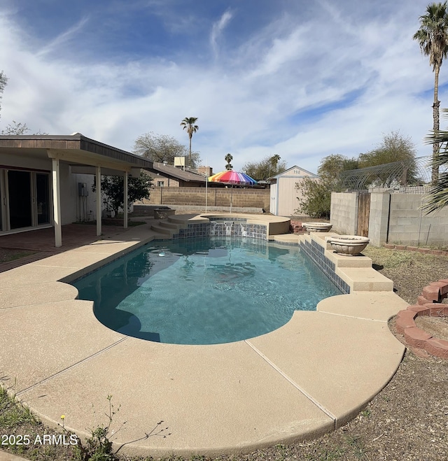 view of pool with a fenced in pool, a patio, a shed, a fenced backyard, and an outdoor structure