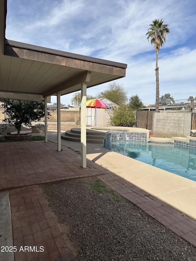 view of swimming pool featuring a fenced in pool, a patio area, and a fenced backyard