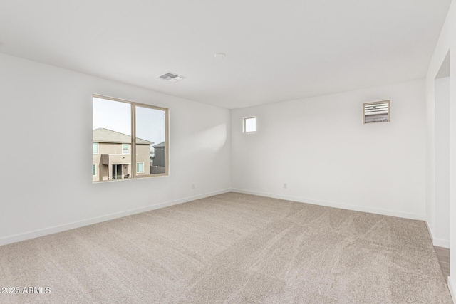 unfurnished room featuring carpet