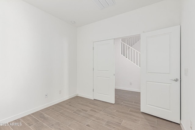 spare room featuring light wood-type flooring