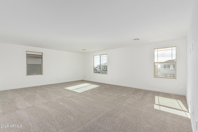 unfurnished room with light colored carpet