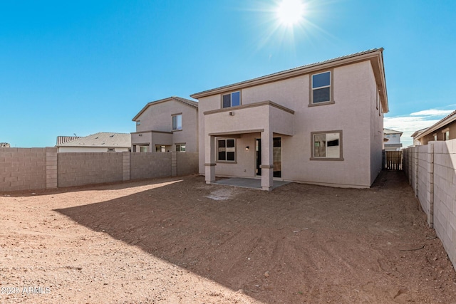 back of property with a patio area