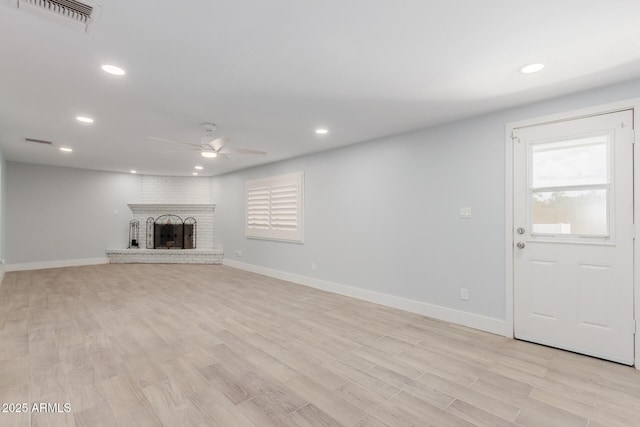 unfurnished living room featuring light wood-type flooring, visible vents, a ceiling fan, recessed lighting, and baseboards