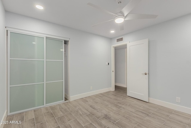 unfurnished bedroom with recessed lighting, baseboards, visible vents, and wood finish floors