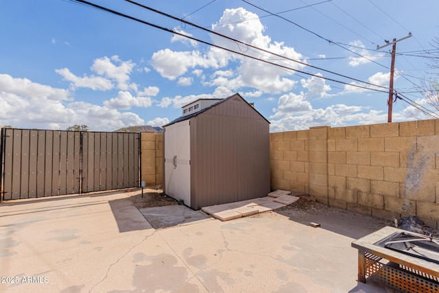 view of shed with a fenced backyard