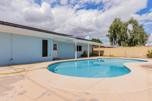 view of pool with a patio, fence, and a fenced in pool