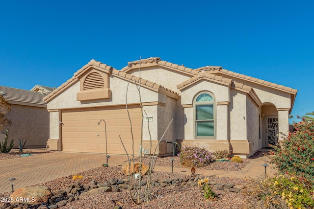 view of front of property with a garage