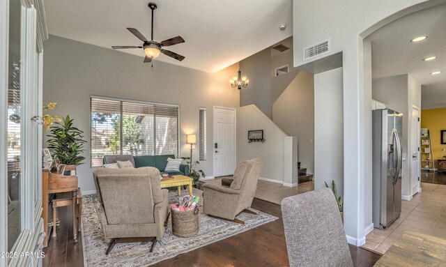 1697 E Linda Ln, Gilbert, AZ 85234 - living area featuring high vaulted ceiling, stairway, a ceiling fan, arched walkways, and baseboards