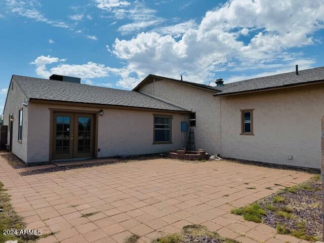 rear view of property with a patio and french doors