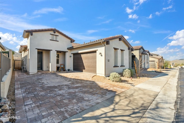 38500 N School House Rd Unit 62, Cave Creek, AZ 85331 - mediterranean / spanish home with a tiled roof, stucco siding, an attached garage, and decorative driveway