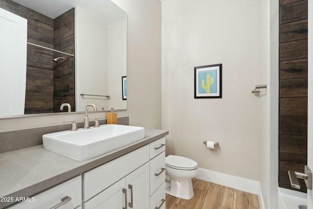 38500 N School House Rd Unit 62, Cave Creek, AZ 85331 - full bath with baseboards, walk in shower, toilet, wood finished floors, and vanity