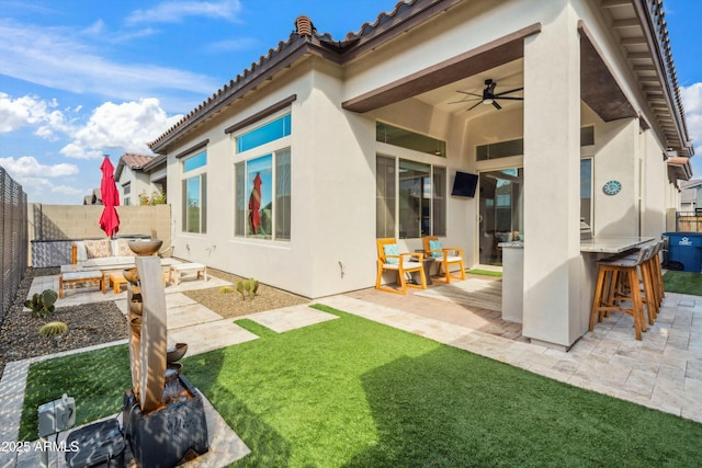 38500 N School House Rd Unit 62, Cave Creek, AZ 85331 - rear view of property featuring a fenced backyard, a ceiling fan, outdoor dry bar, and a patio