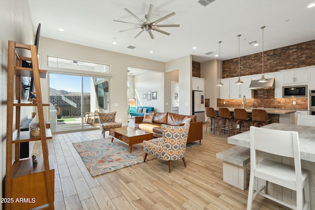 38500 N School House Rd Unit 62, Cave Creek, AZ 85331 - living area with a high ceiling, visible vents, light wood finished floors, and ceiling fan