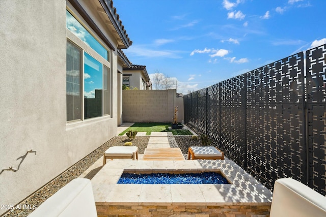 38500 N School House Rd Unit 62, Cave Creek, AZ 85331 - exterior space with a fenced backyard and an outdoor fire pit