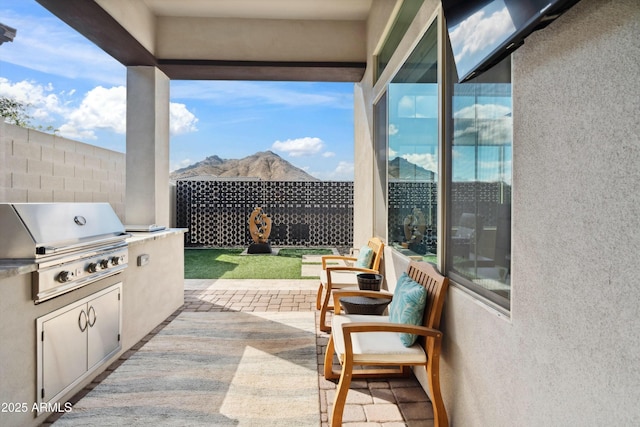 38500 N School House Rd Unit 62, Cave Creek, AZ 85331 - view of patio with area for grilling, a mountain view, and fence