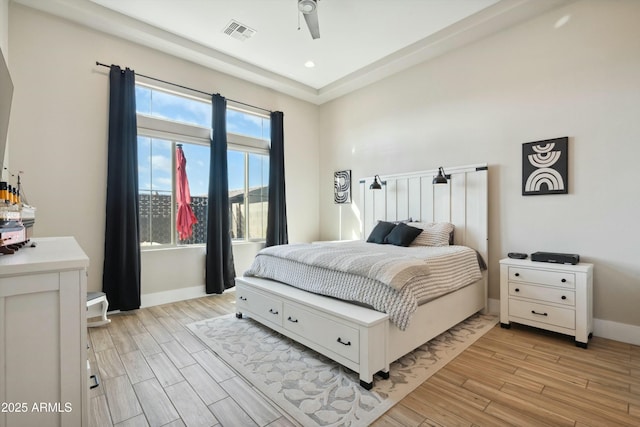 38500 N School House Rd Unit 62, Cave Creek, AZ 85331 - bedroom with visible vents, baseboards, light wood-style floors, and ceiling fan