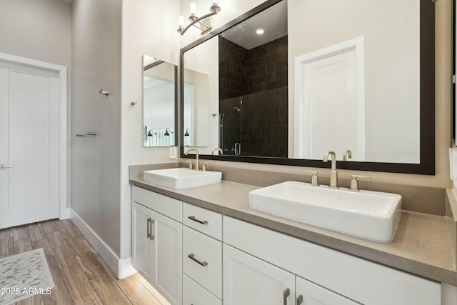 38500 N School House Rd Unit 62, Cave Creek, AZ 85331 - full bathroom with a shower stall, wood finished floors, double vanity, and a sink