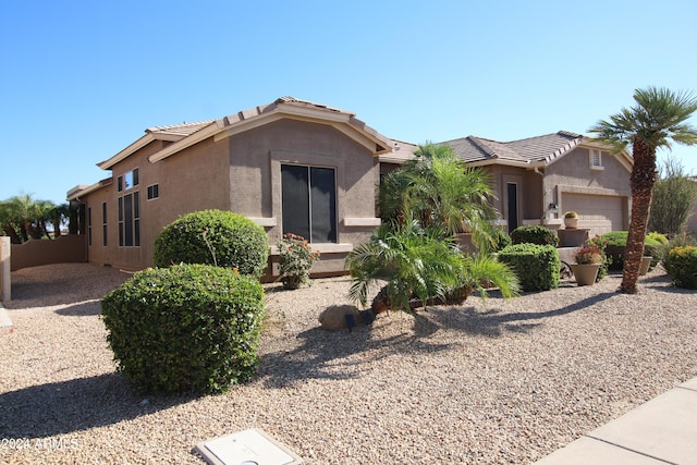 view of front of property with a garage