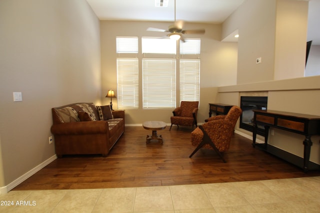 sitting room with ceiling fan and light tile patterned floors