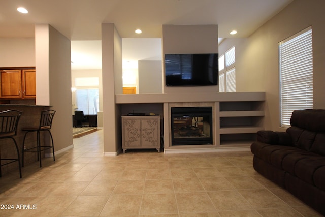 tiled living room with a wealth of natural light