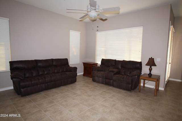 tiled living room with ceiling fan