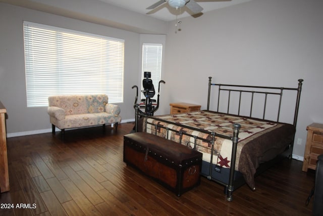 bedroom with ceiling fan and dark hardwood / wood-style floors