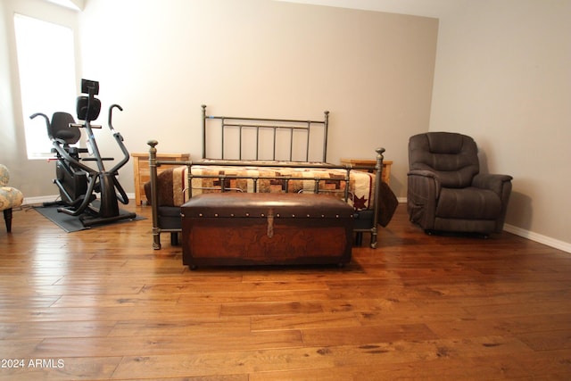 bedroom with wood-type flooring