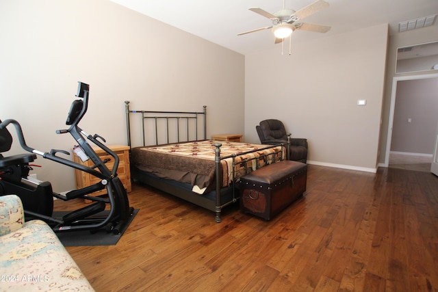 bedroom featuring ceiling fan and dark hardwood / wood-style floors