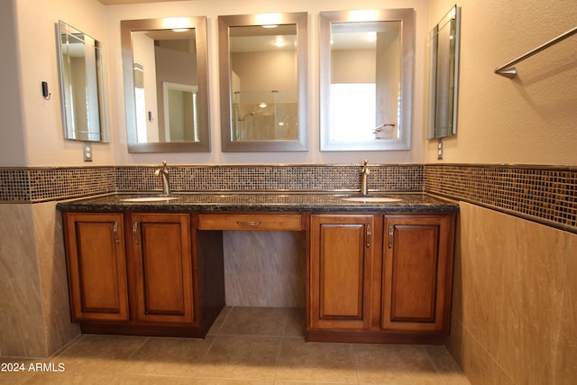 bathroom featuring tile patterned floors, vanity, and tile walls