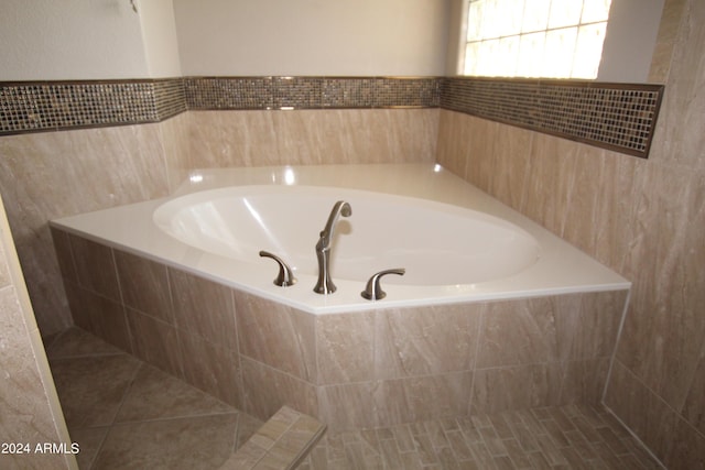 bathroom featuring tiled bath