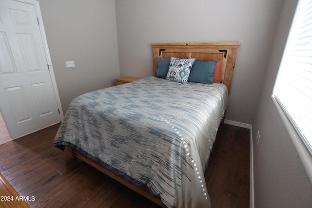 bedroom featuring dark hardwood / wood-style floors