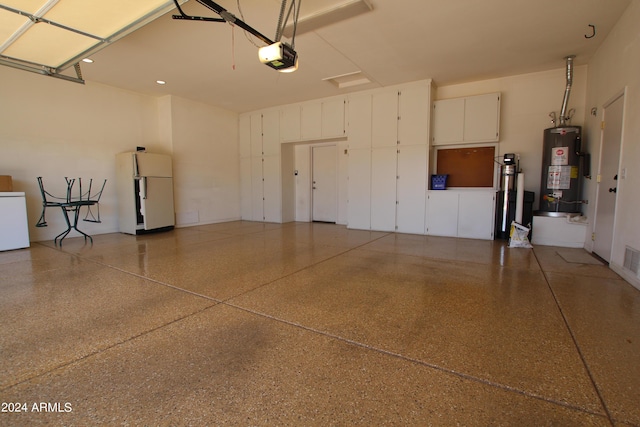 garage with refrigerator, white fridge, a garage door opener, and water heater