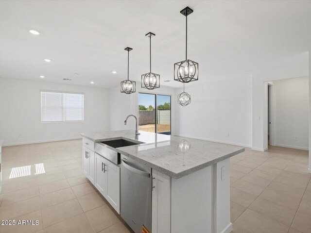 37357 W San Sisto Ave, Maricopa, AZ 85138 - kitchen with dishwasher, open floor plan, a chandelier, a kitchen island with sink, and recessed lighting