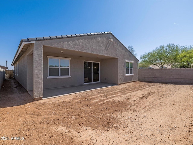 37357 W San Sisto Ave, Maricopa, AZ 85138 - back of property with a fenced backyard, a patio, and stucco siding