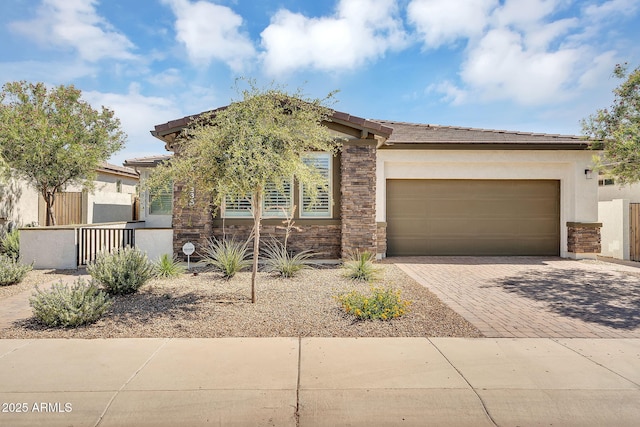 1335 W Via Del Oro, San Tan Valley, AZ 85140 - view of front of property with decorative driveway, stucco siding, a garage, and stone siding