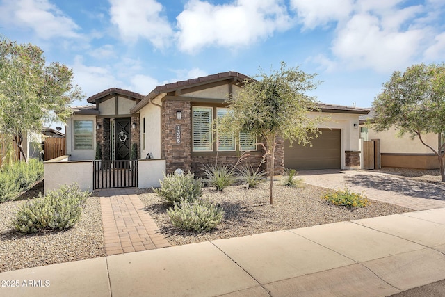1335 W Via Del Oro, San Tan Valley, AZ 85140 - view of front of house featuring stucco siding, a gate, driveway, and a fenced front yard