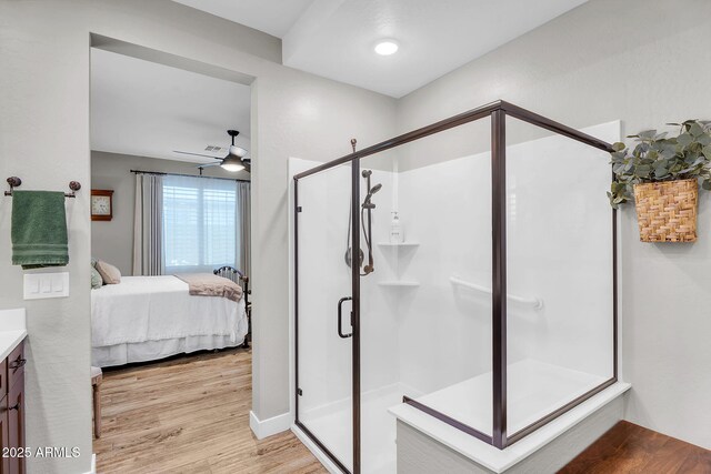 1335 W Via Del Oro, San Tan Valley, AZ 85140 - ensuite bathroom with vanity, wood finished floors, a shower stall, and a ceiling fan