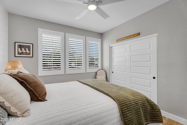 1335 W Via Del Oro, San Tan Valley, AZ 85140 - bedroom with baseboards, wood finished floors, a closet, and a ceiling fan