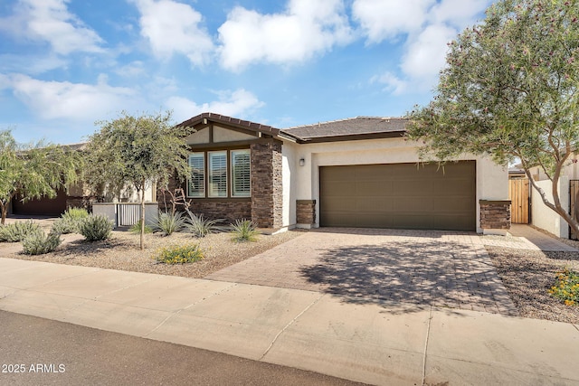 1335 W Via Del Oro, San Tan Valley, AZ 85140 - view of front of home with stone siding, stucco siding, decorative driveway, and a garage