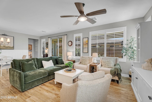 1335 W Via Del Oro, San Tan Valley, AZ 85140 - living area featuring a ceiling fan and light wood-style floors