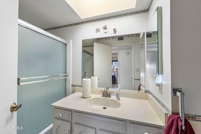 bathroom featuring visible vents and vanity