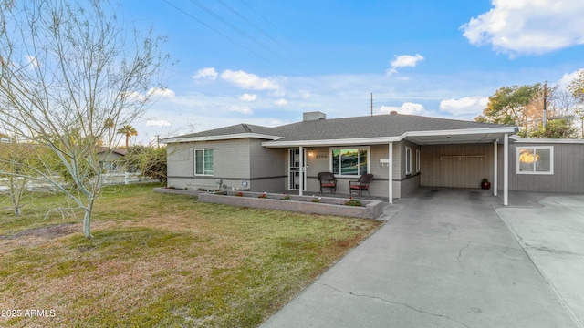 single story home with driveway, a front lawn, an attached carport, and roof with shingles