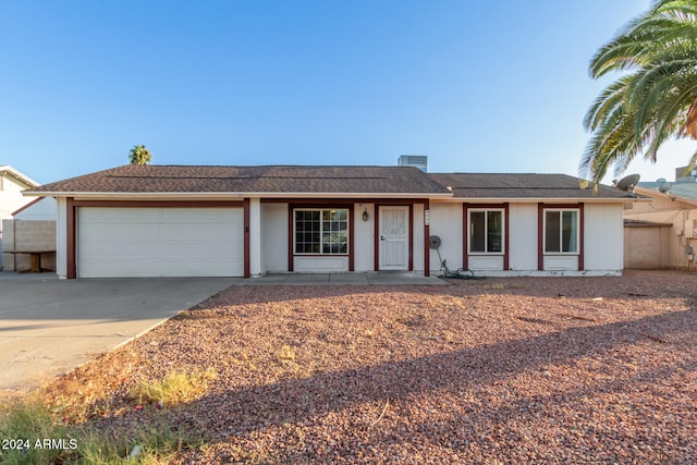 single story home featuring a garage